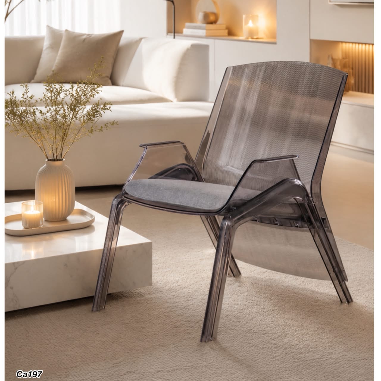 Silla gris transparente con cojín en textil plástico policarbonado 67cm* 83.5cm* 91.5cm
