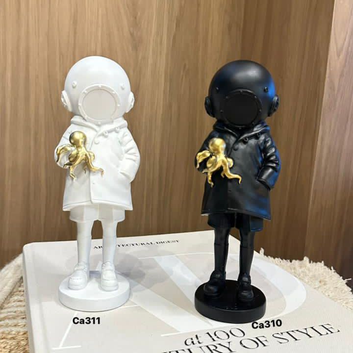 Articulo decorativo astronauta blanco pulpo dorado resina 10cm* 7,5cm* 23cm