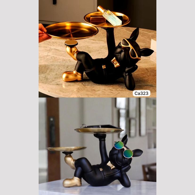 Articulo decorativo perro negro acostado brazo izquierdo 29cm* 19cm* 19cm