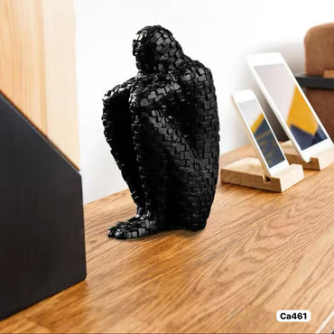 Articulo decorativo figura humano negro resina 8cm* 11cm* 20cm