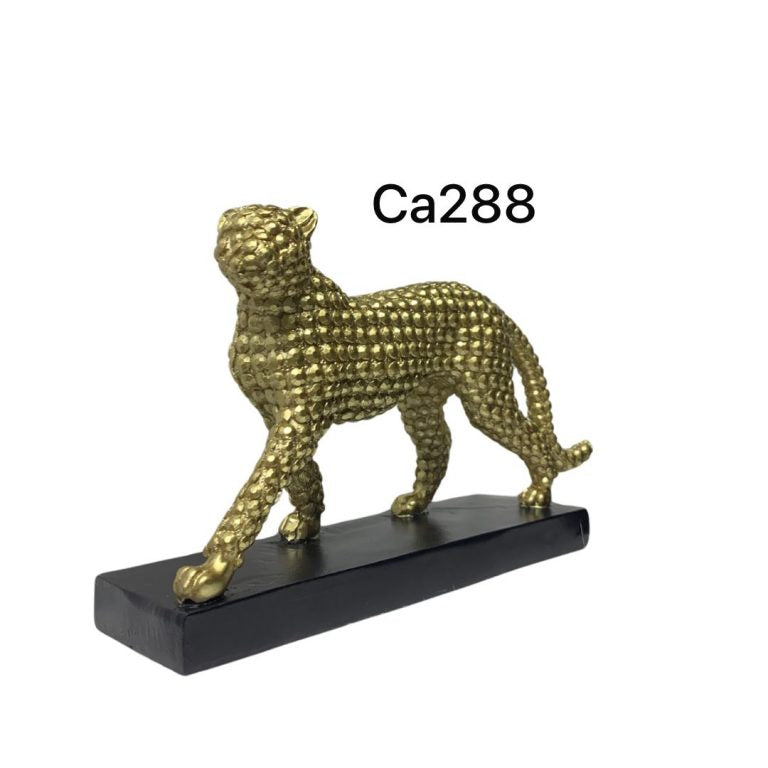 Articulo decorativo jaguar caminando dorado base negro 21cm* 7cm* 13cm