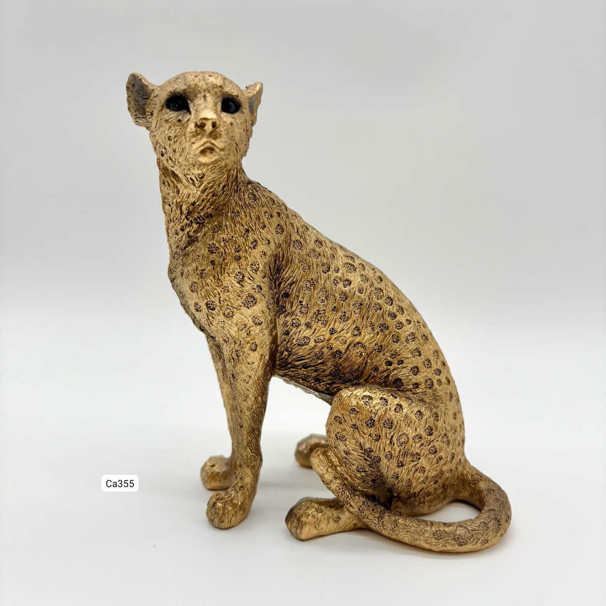 Articulo decorativo leopardo dorado sentado 13cm* 8,5cm* 15,5cm