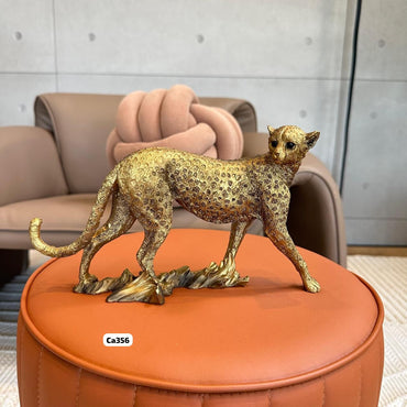 Articulo decorativo leopardo dorado caminando 25cm* 7,5cm* 14,5cm