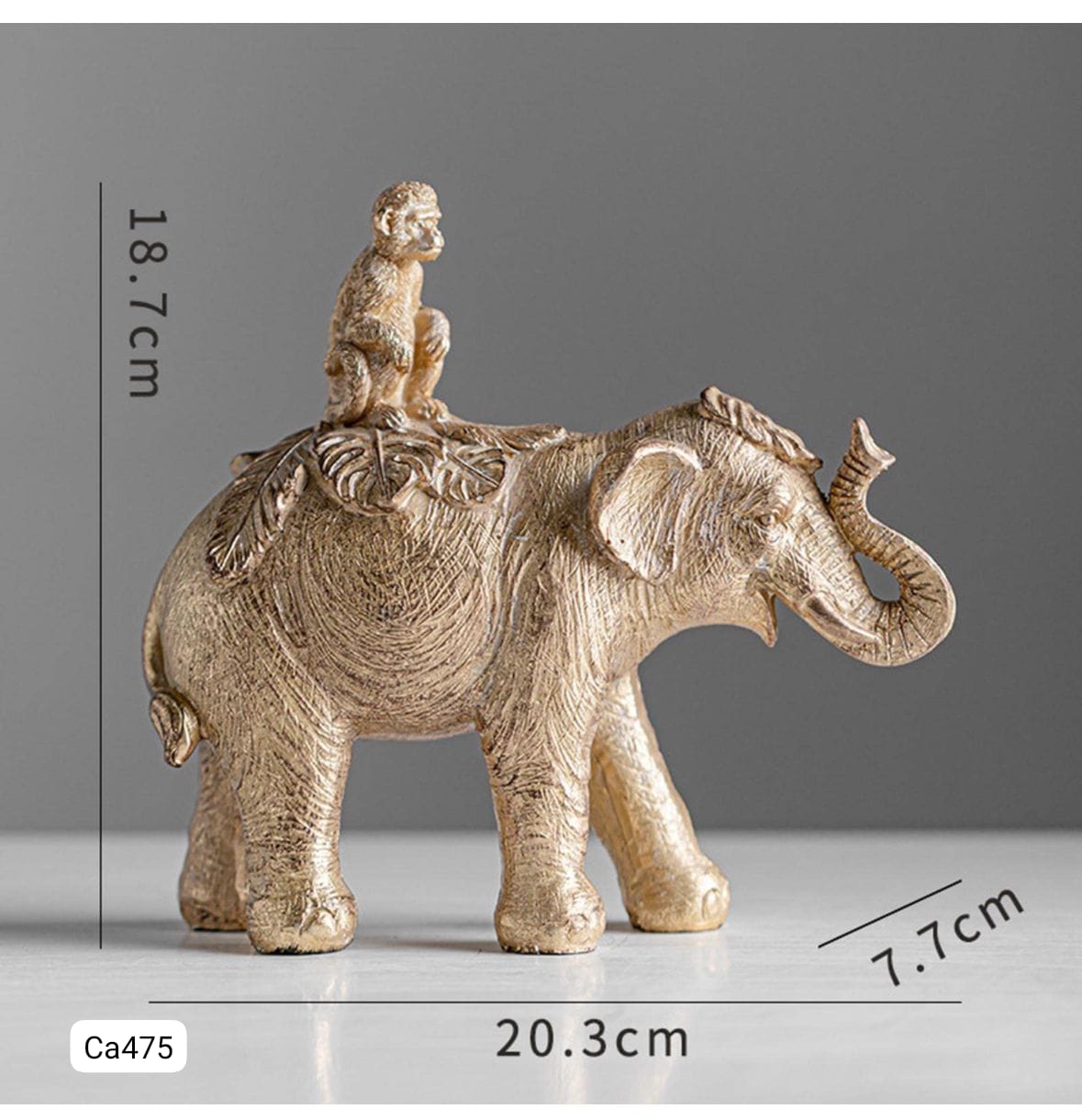 Articulo decorativo elefante dorado con mono sobre el 20,3* 7,7cm* 18,7cm