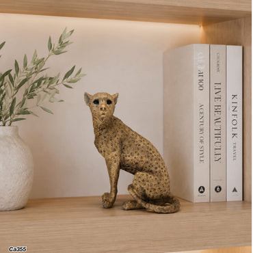 Articulo decorativo leopardo dorado sentado 13cm* 8,5cm* 15,5cm