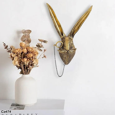 Articulo decorativo conejo dorado de pared 14cm* 10cm* 26,5cm