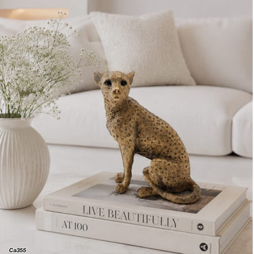 Articulo decorativo leopardo dorado sentado 13cm* 8,5cm* 15,5cm