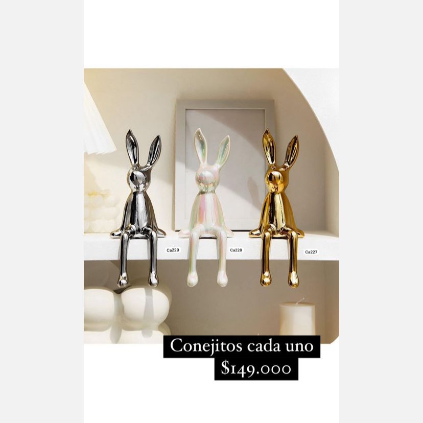 Articulo decorativo conejo plateado pequeño 8cm* 10cm* 21cm