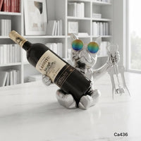 Articulo decorativo porta vino perro plateado sentado  25cm* 18cm* 21cm