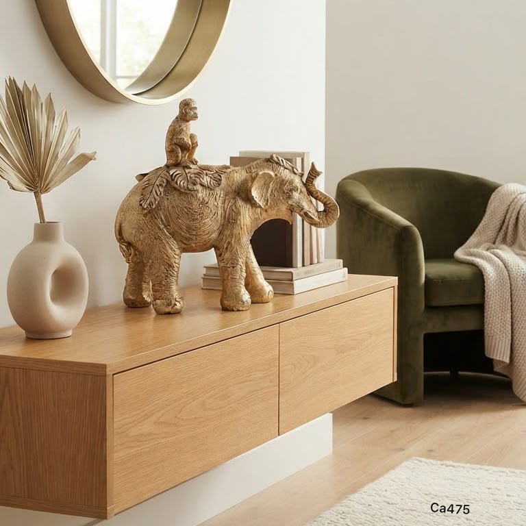 Articulo decorativo elefante dorado con mono sobre el   20,3* 7,7cm* 18,7cm