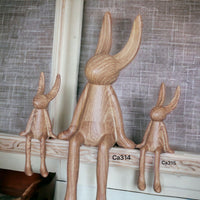 Articulo decorativo conejo mediano apariencia madera  8,5cm* 6cm* 21cm