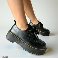 Zapato negro detalle amarillo suela 5cm  255-053