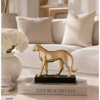 Articulo decorativo leopardo dorado base negro resina  18cm* 6cm* 15cm