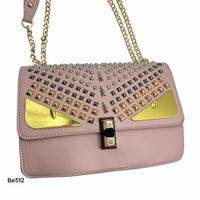 Bolso rosado apliques plateado ojos y cadena dorado  22cm* 9cm* 17cm  C- 23196-1
