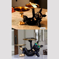 Articulo decorativo perro negro acostado brazo izquierdo  29cm* 19cm* 19cm