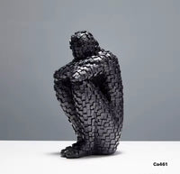 Articulo decorativo figura humano negro resina  8cm* 11cm* 20cm