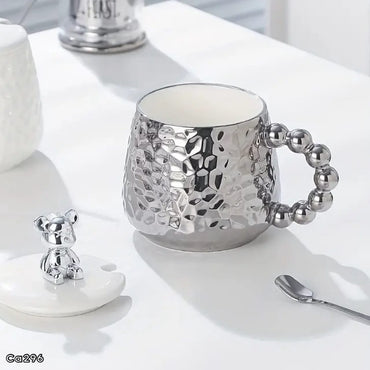 Mugs plateado ceramica detalle oso en tapa manija bolas  430ml