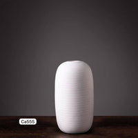 Florero moderno blanco ceramica  12cm* 12cm* 25cm