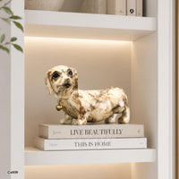 Articulo decorativo perro salchicha beige marmolizado detalle dorado  22cm* 9cm* 13cm