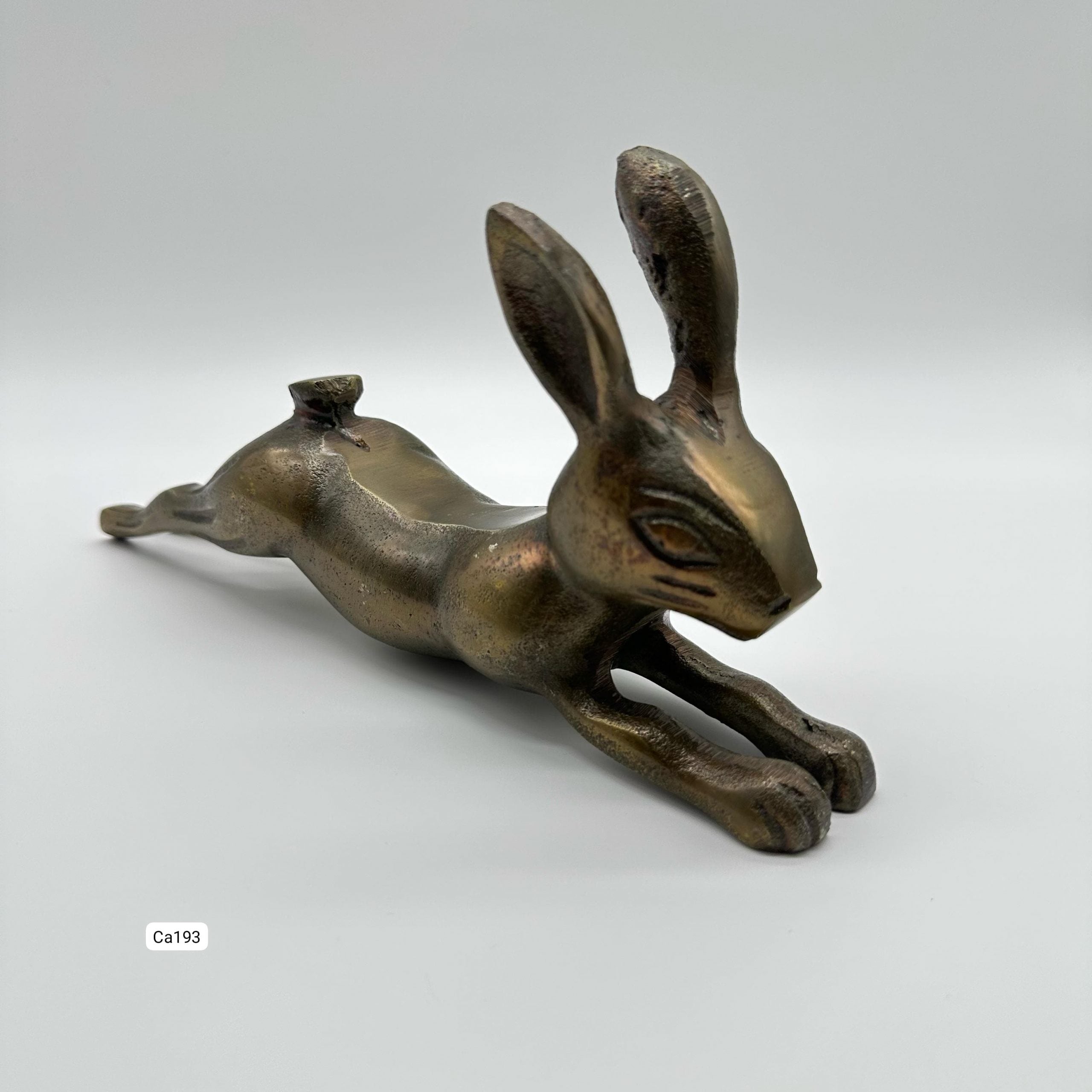 Articulo decorativo conejo en metal dorado 13cm* 7cm* 28cm