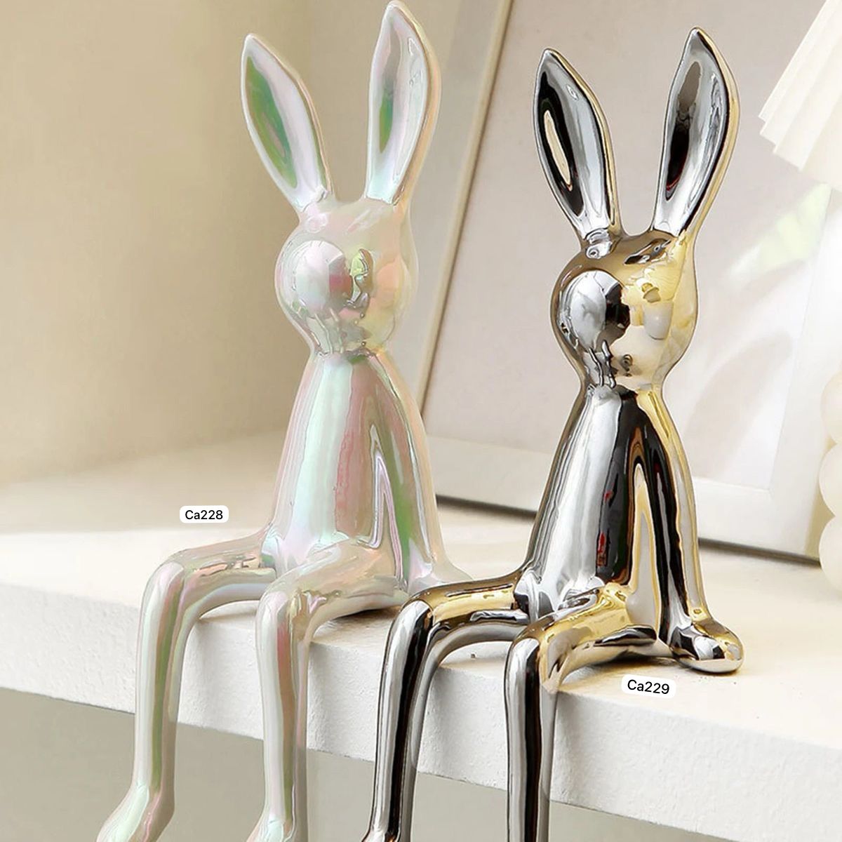 Articulo decorativo conejo plateado pequeño 8cm* 10cm* 21cm