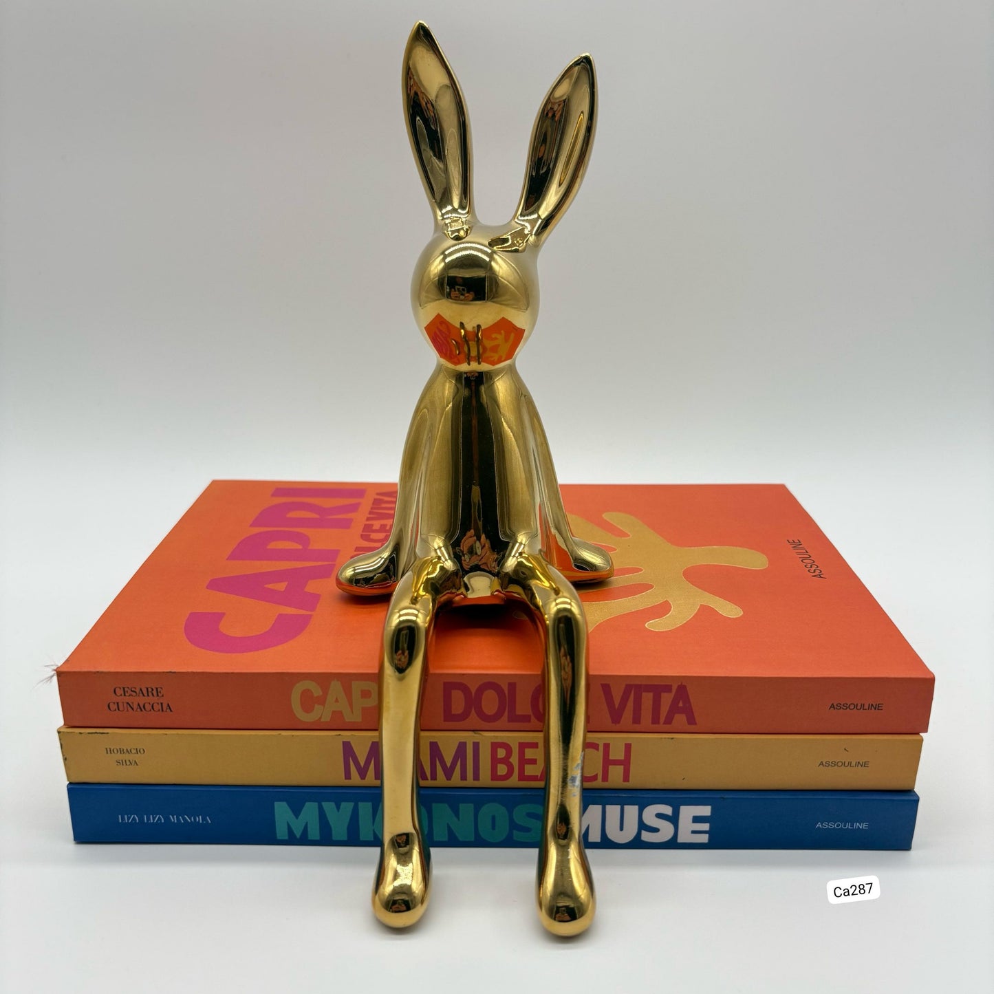 Articulo decorativo conejo dorado pequeño  8cm* 10cm* 21cm