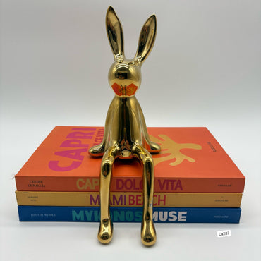 Articulo decorativo conejo dorado pequeño  8cm* 10cm* 21cm