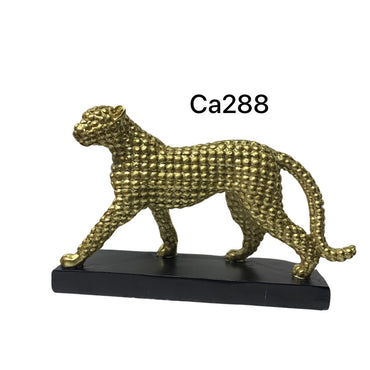 Articulo decorativo jaguar caminando dorado base negro  21cm* 7cm* 13cm