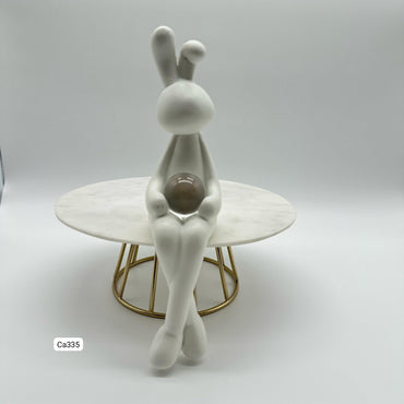 Articulo decorativo conejo blanco piernas cruzadas detalle bola cristal  5,3* 9,3* 19,8cm