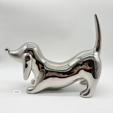 Articulo decorativo perro salchicha plateado  28cm* 22cm