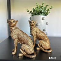 Articulo decorativo leopardo dorado sentado  13cm* 8,5cm* 15,5cm