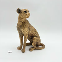 Articulo decorativo leopardo dorado sentado  13cm* 8,5cm* 15,5cm