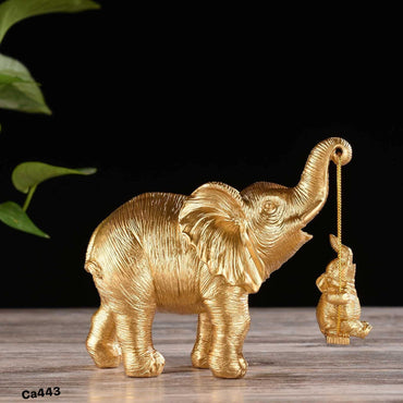 Articulo decorativo elefantes dorado cuerda 16cm* 8cm* 14,5cm