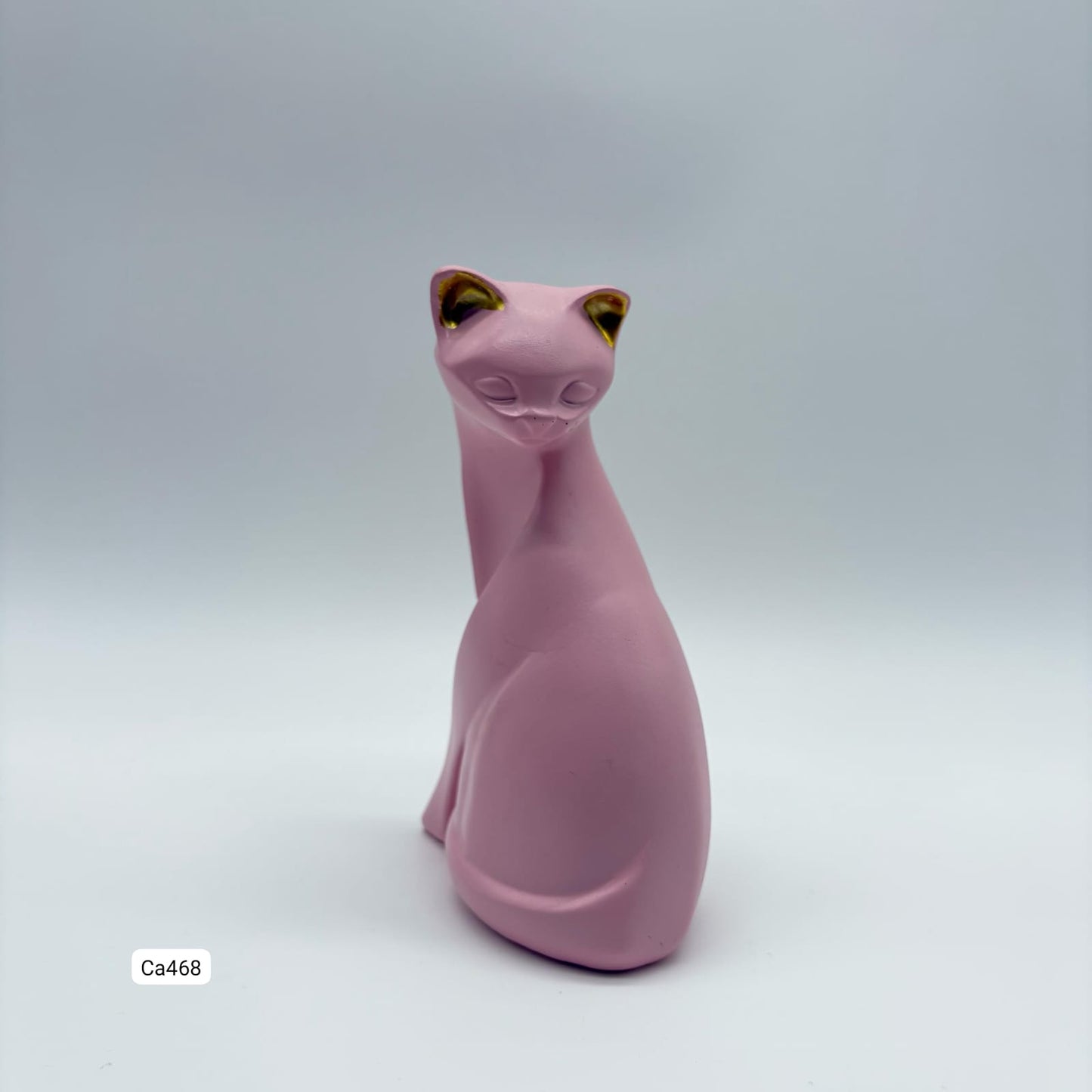 Articulo decorativo gato rosado sentado  9cm* 5cm* 14cm