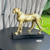 Articulo decorativo leopardo dorado base negro resina  18cm* 6cm* 15cm