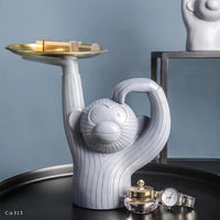 Articulo decorativo mono resina gris bandeja dorada  28,5cm* 14cm* 30cm