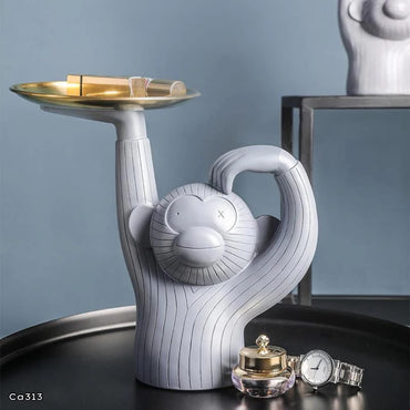 Articulo decorativo mono resina gris bandeja dorada  28,5cm* 14cm* 30cm